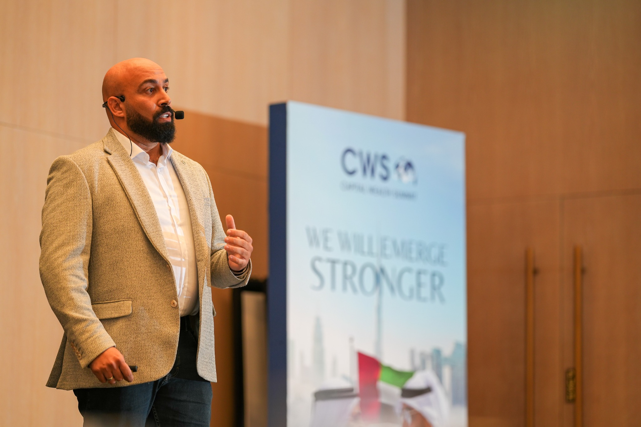 Ahmed Khaled speaking at an event in Dubai