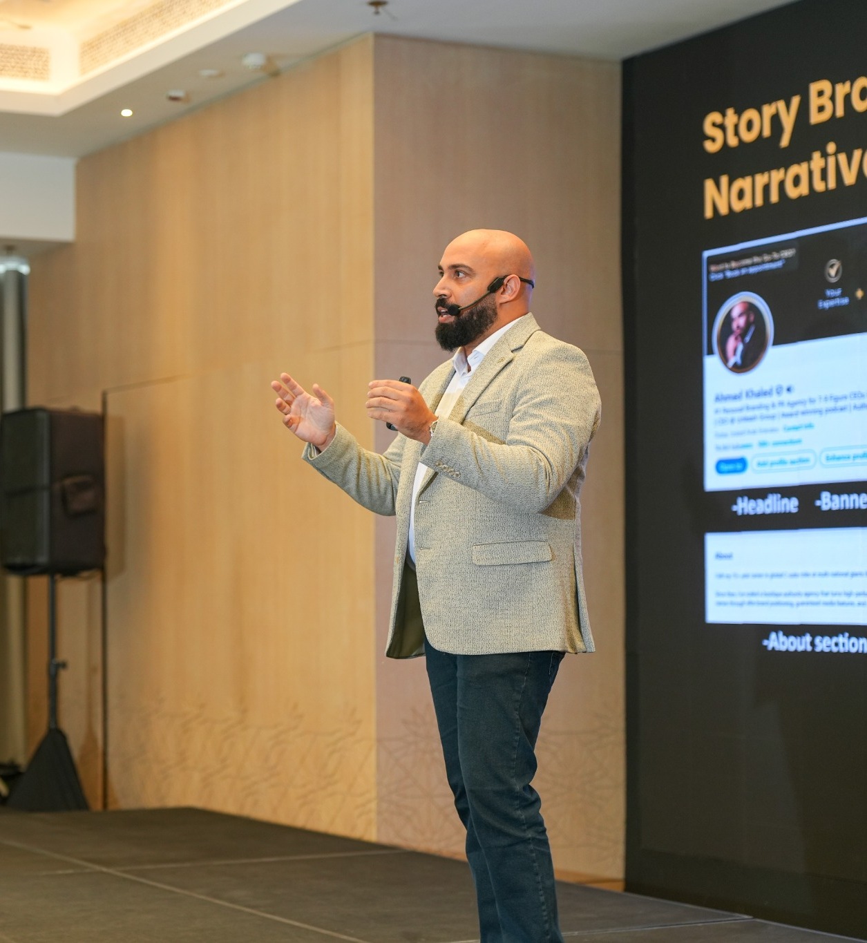 Ahmed Khaled speaking at an executive event